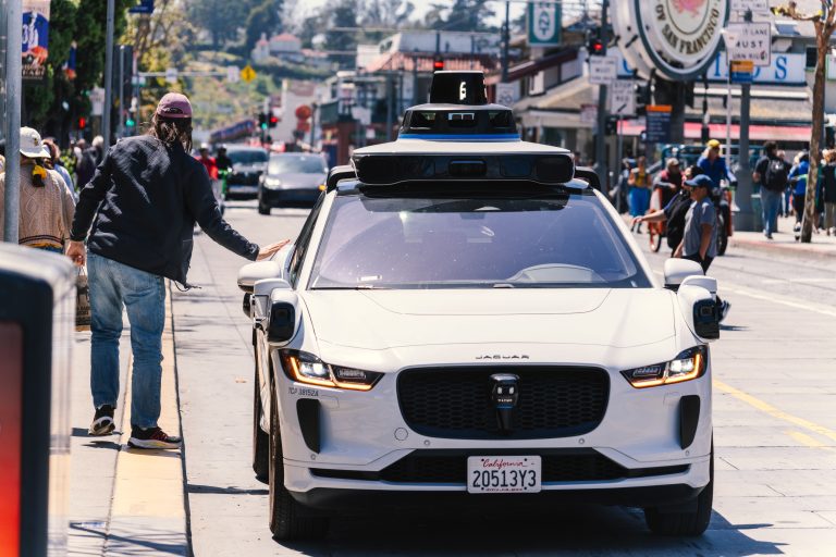 Autonomous Vehicle Insurance Expands as Texas Tightens Regulations 1 A self-driving car navigates a busy city street