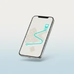 Phone with simple map and glowing route to a train station, symbolizing AI-guided last-minute travel decision.