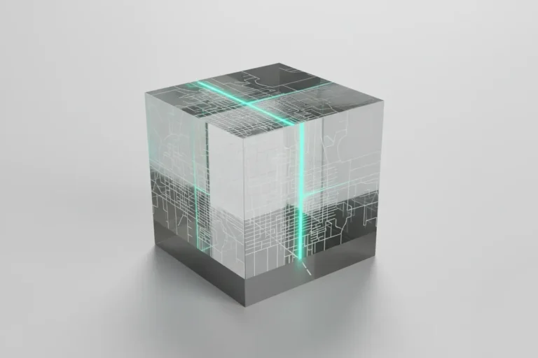 Clear acrylic cube with a faint road grid and one glowing teal route, symbolizing simplified smart infrastructure data.