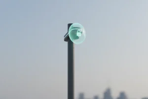 Modern streetlight sensor in a translucent shield, symbolizing privacy in smart infrastructure, against a soft urban background.