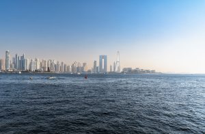 Stock waterfront view of Dubai skyline and Ain Dubai on Bluewaters Island