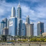 A vibrant view of the iconic Dubai skyline showcasing modern skyscrapers under a clear blue sky