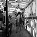 Monochrome view inside a Hong Kong lighting store, highlighting diverse fixtures and designs